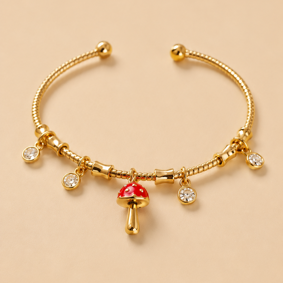 Mushroom Gold bracelet with charms on a beige background